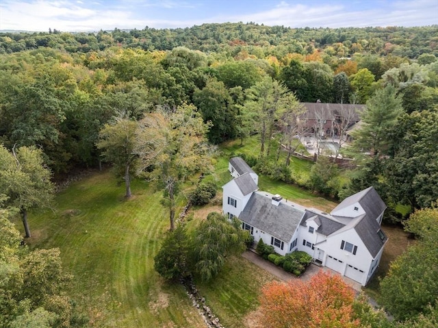 bird's eye view featuring a wooded view