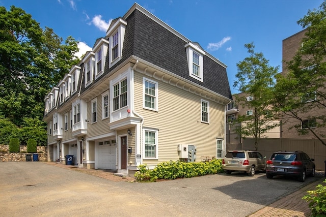 view of side of home with a garage