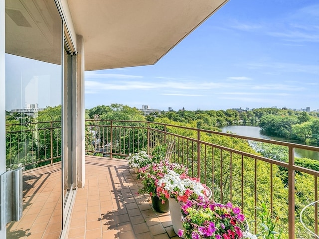 balcony featuring a water view