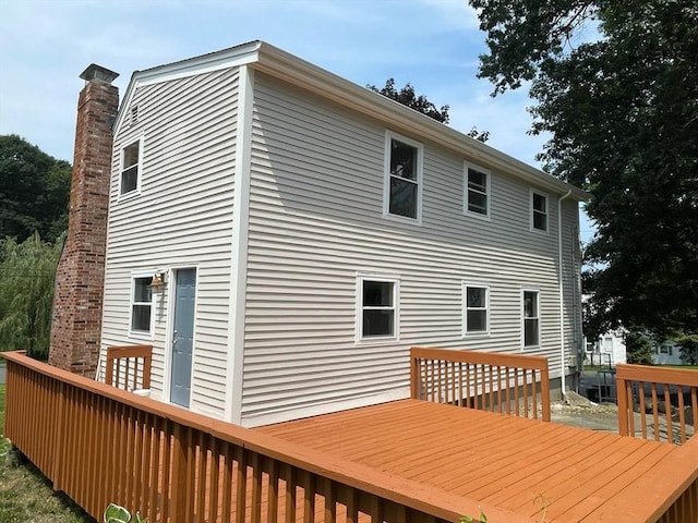 rear view of house featuring a deck