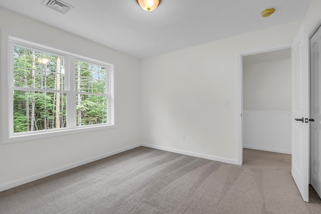 unfurnished bedroom with light carpet