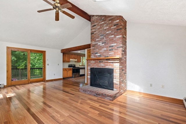 199 Old Westboro Rd, Grafton, MA 01536 - unfurnished living room with light wood finished floors, beamed ceiling, a ceiling fan, a fireplace, and high vaulted ceiling