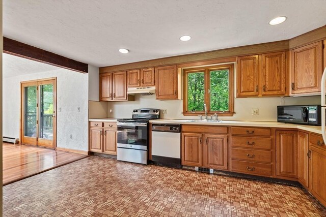199 Old Westboro Rd, Grafton, MA 01536 - kitchen featuring white dishwasher, under cabinet range hood, electric range, a baseboard heating unit, and black microwave