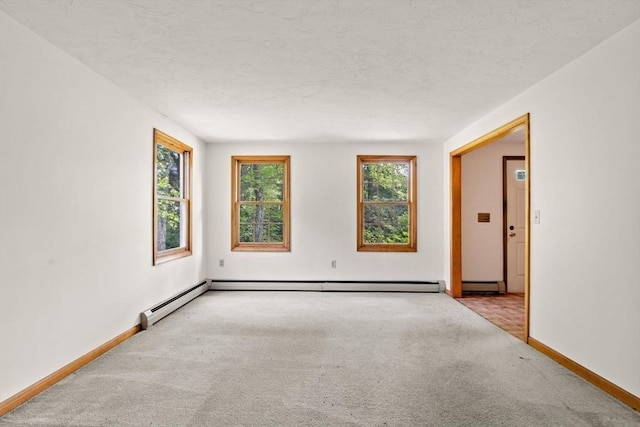 199 Old Westboro Rd, Grafton, MA 01536 - carpeted empty room with a textured ceiling and a baseboard radiator