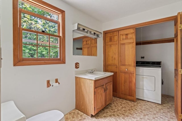 199 Old Westboro Rd, Grafton, MA 01536 - bathroom featuring washer / clothes dryer, vanity, and tile patterned floors
