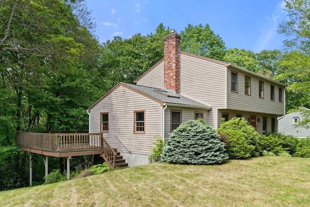 199 Old Westboro Rd, Grafton, MA 01536 - view of property exterior with a yard, a chimney, and a wooden deck
