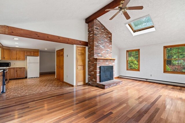 199 Old Westboro Rd, Grafton, MA 01536 - unfurnished living room featuring a baseboard radiator, a ceiling fan, light wood-type flooring, beam ceiling, and high vaulted ceiling