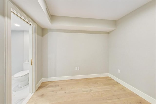 unfurnished room featuring light wood-style floors and baseboards