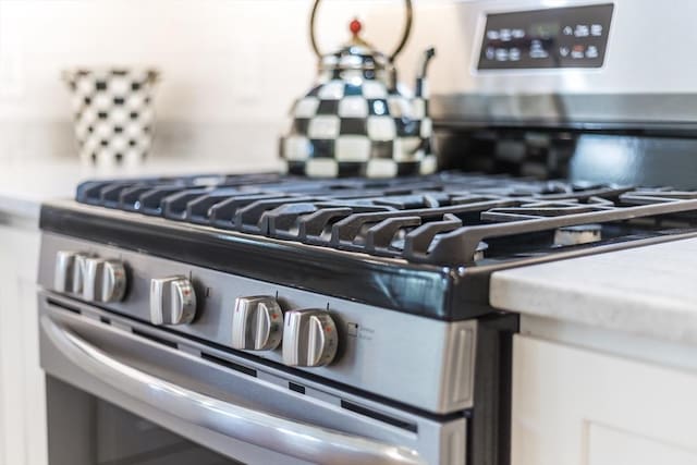 kitchen view of backsplash and gas range