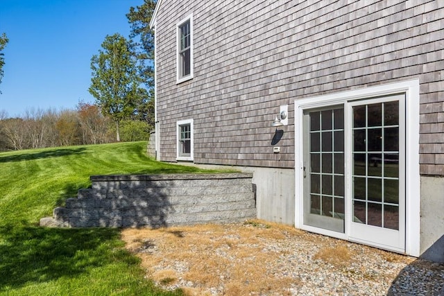 view of side of property with a yard