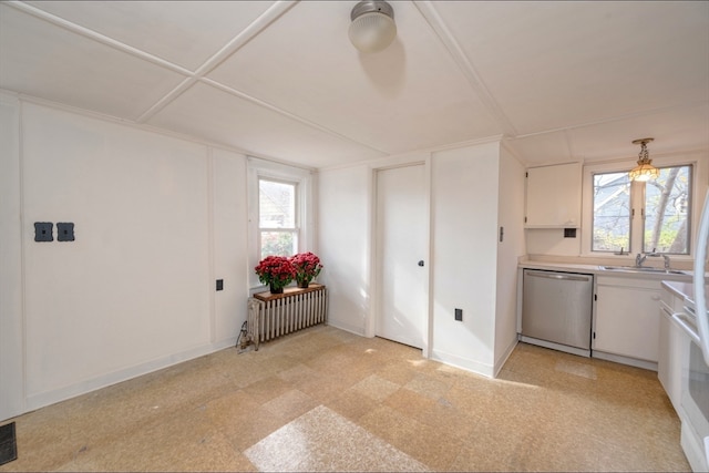 interior space with radiator, ceiling fan, sink, and plenty of natural light