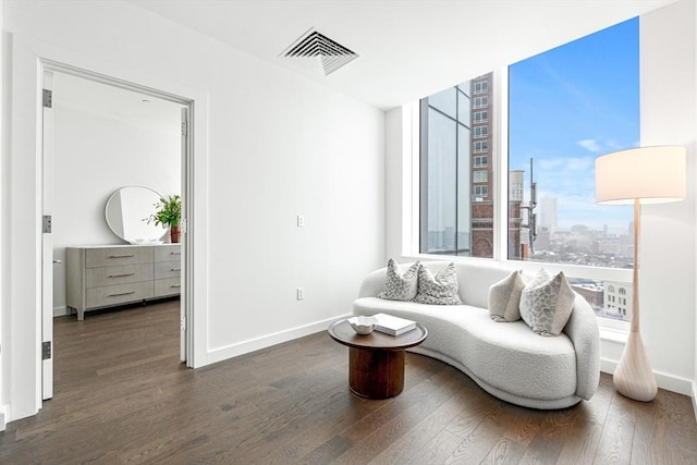 living room with dark hardwood / wood-style flooring