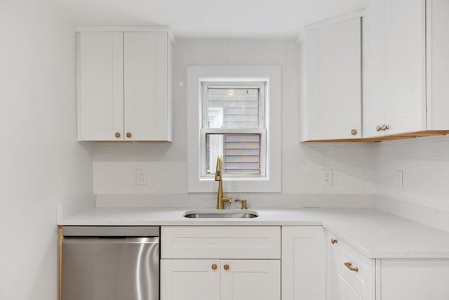 71 Water St, Quincy, MA 02169 - kitchen featuring stainless steel dishwasher, a sink, white cabinets, and light countertops