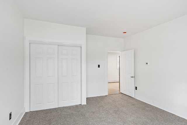 71 Water St, Quincy, MA 02169 - unfurnished bedroom featuring carpet floors, a closet, and baseboards