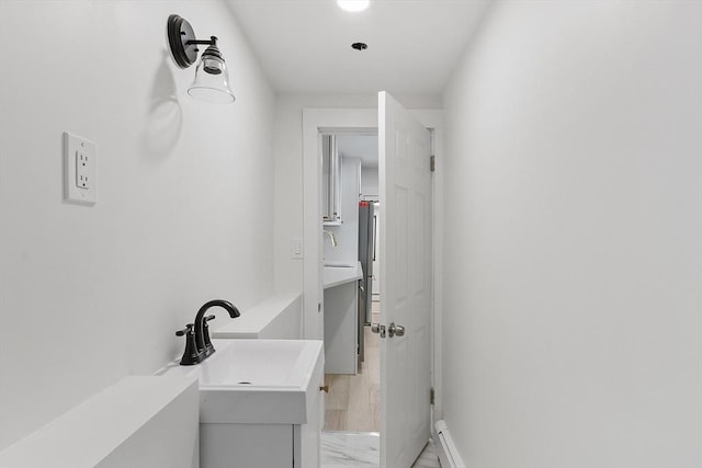71 Water St, Quincy, MA 02169 - bathroom featuring marble finish flooring, vanity, and baseboards