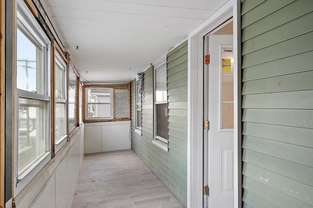 71 Water St, Quincy, MA 02169 - hallway featuring wooden walls and light wood-style floors