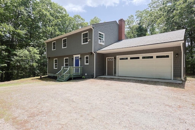 68 Dresser Hill Number 2 Rd, Dudley, MA 01571 - colonial-style house featuring a chimney, driveway, and an attached garage