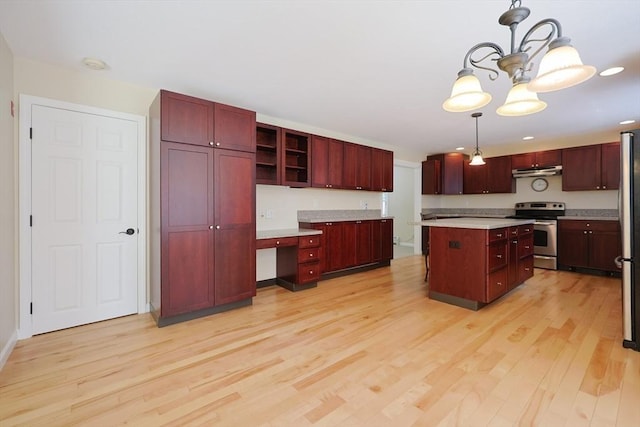 68 Dresser Hill Number 2 Rd, Dudley, MA 01571 - kitchen featuring stainless steel appliances, reddish brown cabinets, under cabinet range hood, light wood-style flooring, and a chandelier