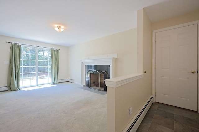 68 Dresser Hill Number 2 Rd, Dudley, MA 01571 - living area with a baseboard heating unit, a fireplace with flush hearth, and carpet