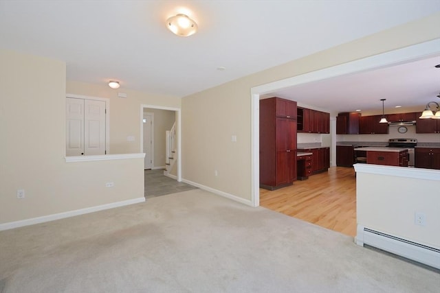 68 Dresser Hill Number 2 Rd, Dudley, MA 01571 - unfurnished living room featuring baseboard heating and light colored carpet