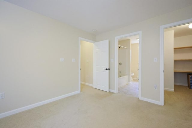 68 Dresser Hill Number 2 Rd, Dudley, MA 01571 - unfurnished bedroom featuring a spacious closet, carpet floors, ensuite bathroom, and a closet