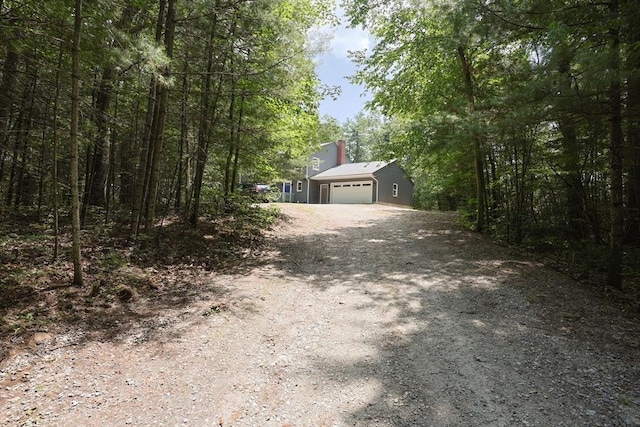 68 Dresser Hill Number 2 Rd, Dudley, MA 01571 - obstructed view of property with driveway, a chimney, and a garage