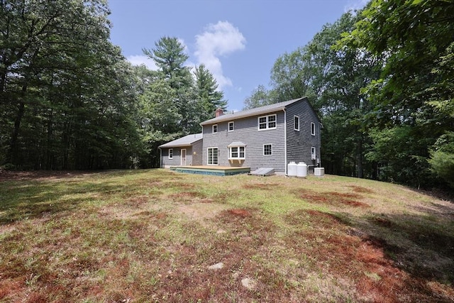 68 Dresser Hill Number 2 Rd, Dudley, MA 01571 - back of house featuring a chimney, a yard, and a wooden deck