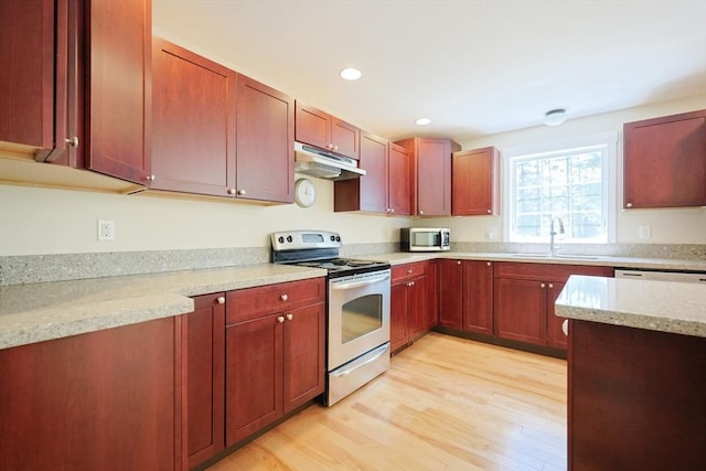 68 Dresser Hill Number 2 Rd, Dudley, MA 01571 - kitchen featuring appliances with stainless steel finishes, under cabinet range hood, light wood-type flooring, recessed lighting, and light stone countertops