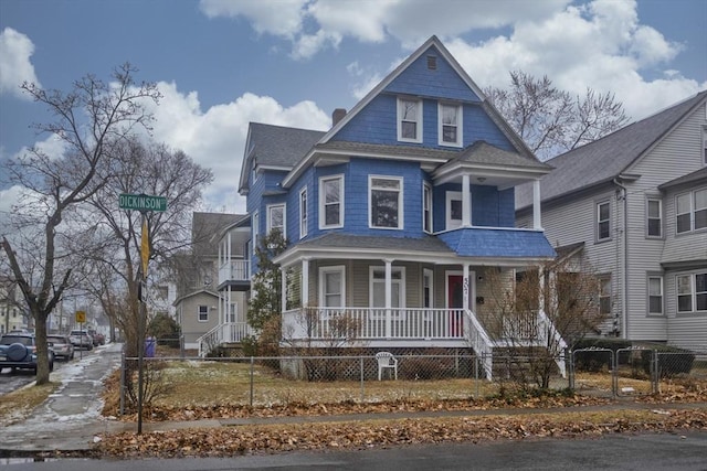 victorian-style house featuring covered porch