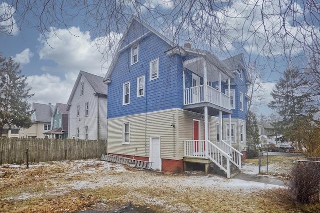 view of home's exterior with a balcony