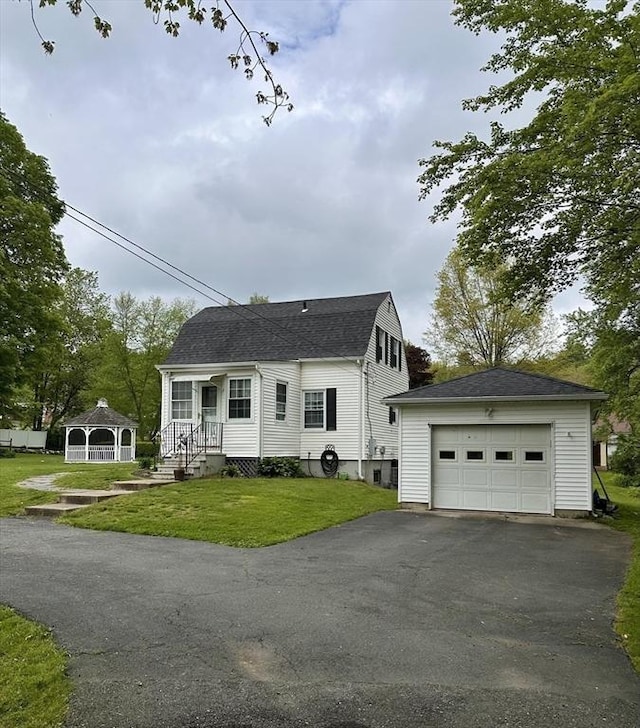 17 Walnut St, Gill, MA 01354 - view of front of house featuring a gazebo, a detached garage, an outbuilding, driveway, and a front lawn