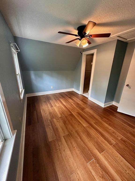 17 Walnut St, Gill, MA 01354 - bonus room with a textured ceiling, ceiling fan, wood finished floors, lofted ceiling, and baseboards