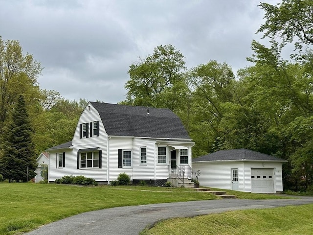 17 Walnut St, Gill, MA 01354 - dutch colonial featuring an outdoor structure, a shingled roof, a front yard, and asphalt driveway
