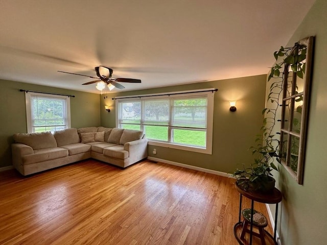 17 Walnut St, Gill, MA 01354 - living area with light wood-type flooring, baseboards, and ceiling fan
