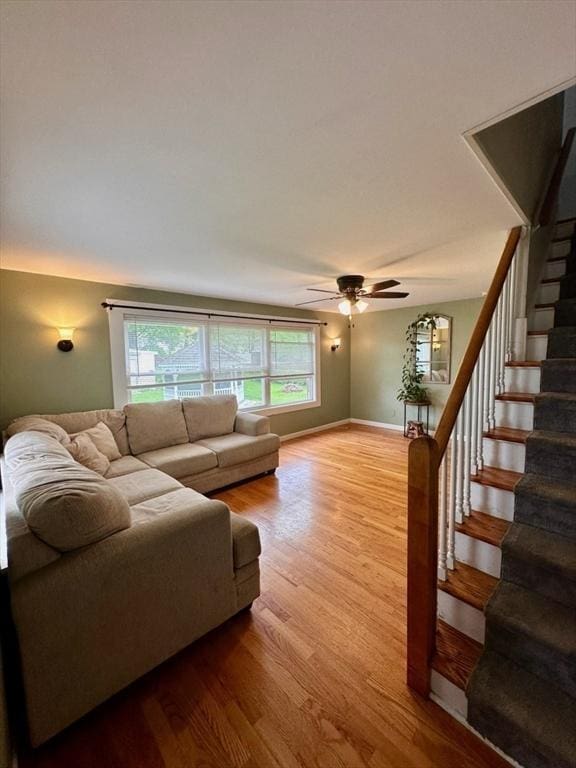 17 Walnut St, Gill, MA 01354 - living room with stairs, ceiling fan, wood finished floors, and baseboards