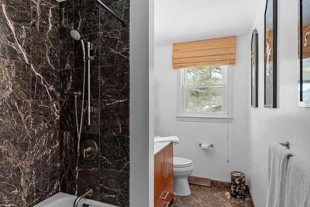 bathroom featuring toilet, radiator heating unit, marble finish floor, bathtub / shower combination, and vanity