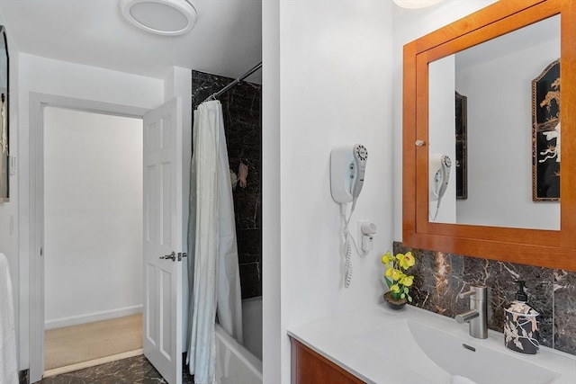 bathroom featuring tasteful backsplash, shower / bathtub combination with curtain, and vanity