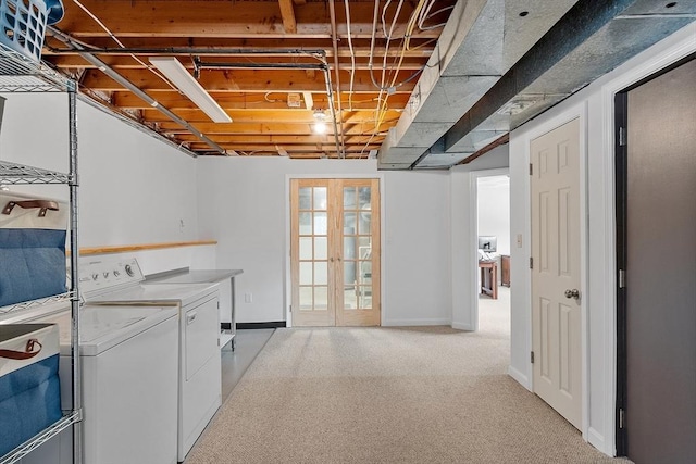 interior space with french doors, carpet flooring, baseboards, and washing machine and clothes dryer