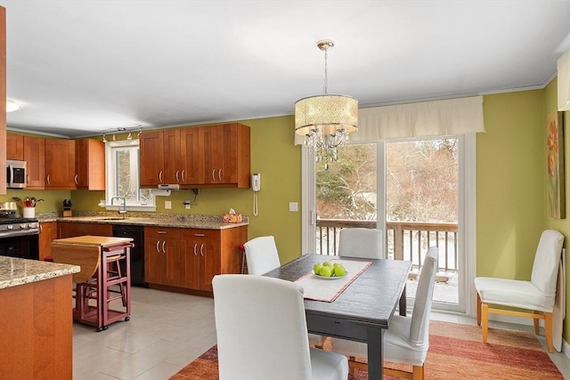 kitchen with black dishwasher, a healthy amount of sunlight, a sink, and stainless steel gas range oven