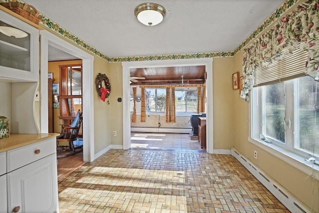 entryway with a baseboard radiator