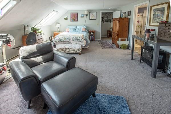 carpeted bedroom featuring lofted ceiling