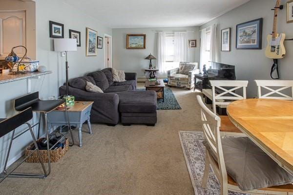 living area featuring light carpet