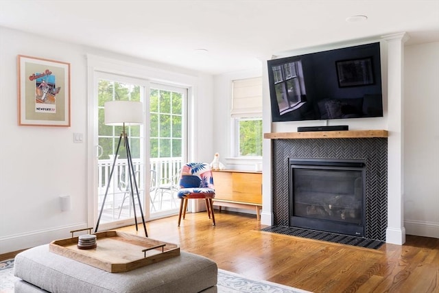 108 Central St, Ipswich, MA 01938 - living area with a tiled fireplace and wood finished floors
