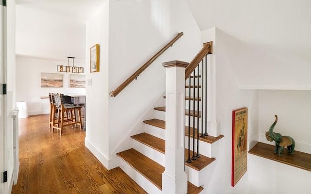 108 Central St, Ipswich, MA 01938 - stairway with wood finished floors and vaulted ceiling