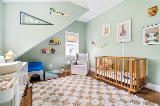 108 Central St, Ipswich, MA 01938 - bedroom featuring a crib and wood finished floors