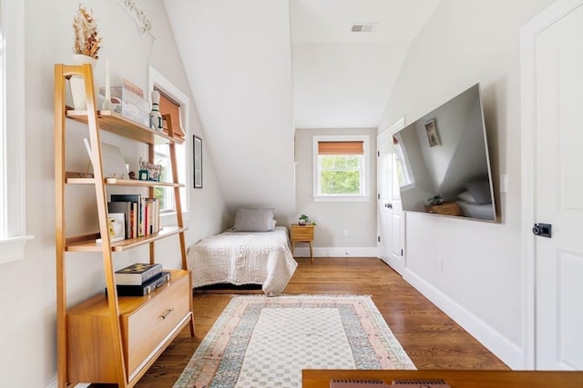 108 Central St, Ipswich, MA 01938 - bedroom with lofted ceiling and dark wood-style flooring