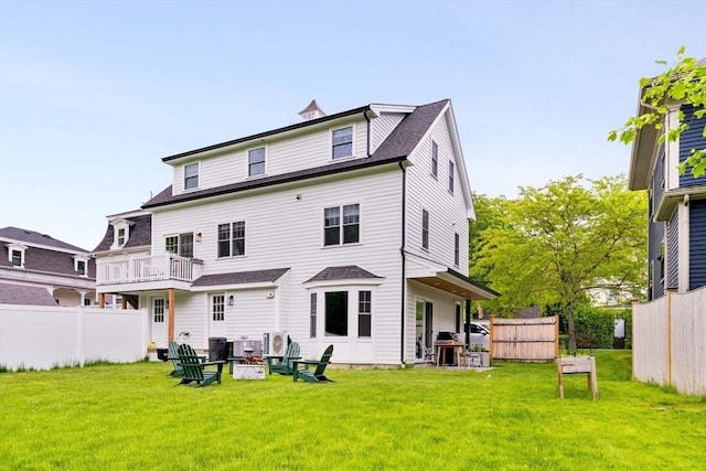 108 Central St, Ipswich, MA 01938 - back of property with an outdoor fire pit and roof with shingles