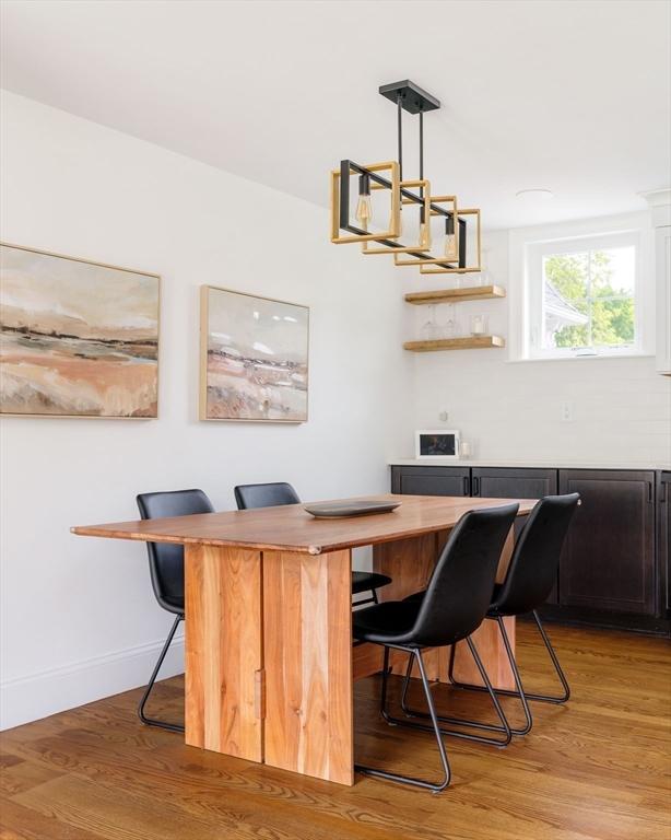 108 Central St, Ipswich, MA 01938 - bar featuring light wood-style flooring and decorative light fixtures