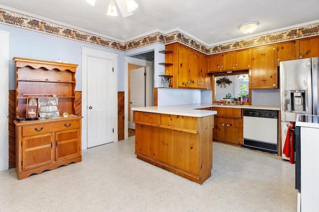 kitchen with ceiling fan, kitchen peninsula, white dishwasher, and ornamental molding