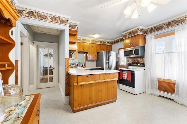 kitchen featuring ceiling fan, backsplash, and appliances with stainless steel finishes